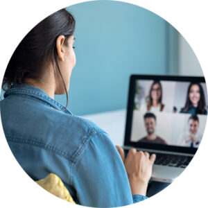 Woman speaking on video call with diverse colleagues conducting an online briefing
